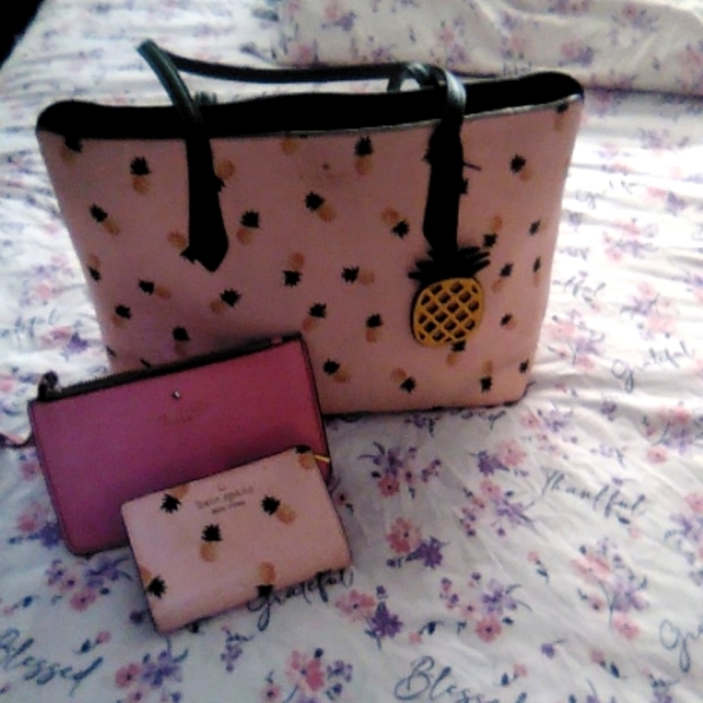 I'm selling one handbag a wallet to match and a little handbag for your wrist.